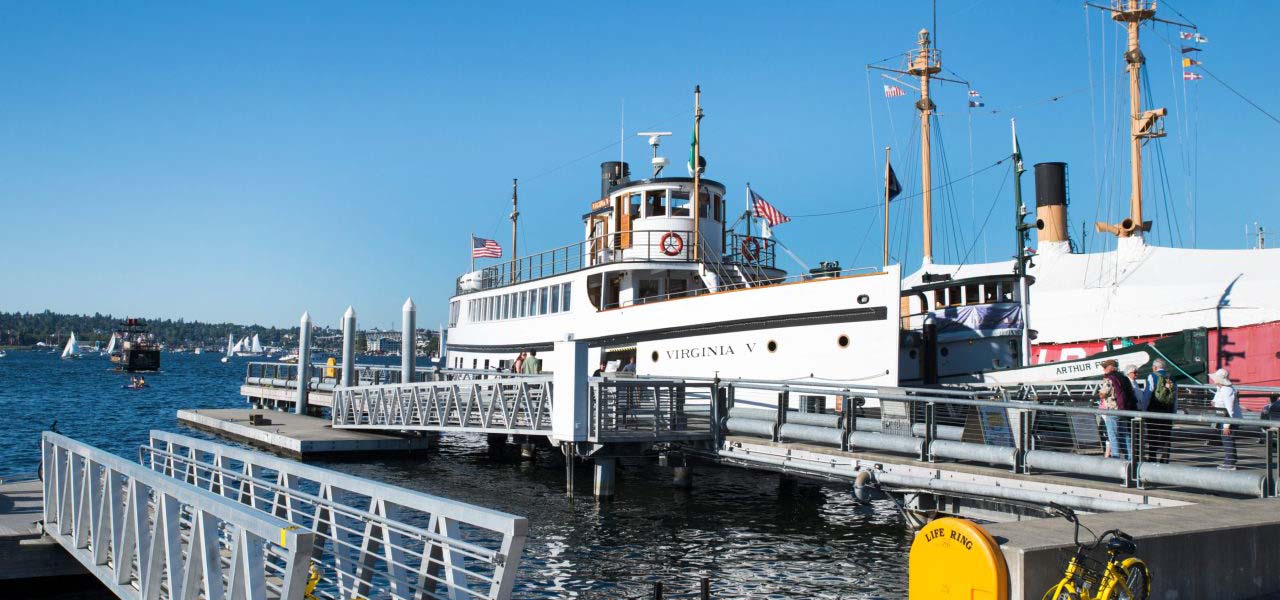 A steamer ship at a dock.
