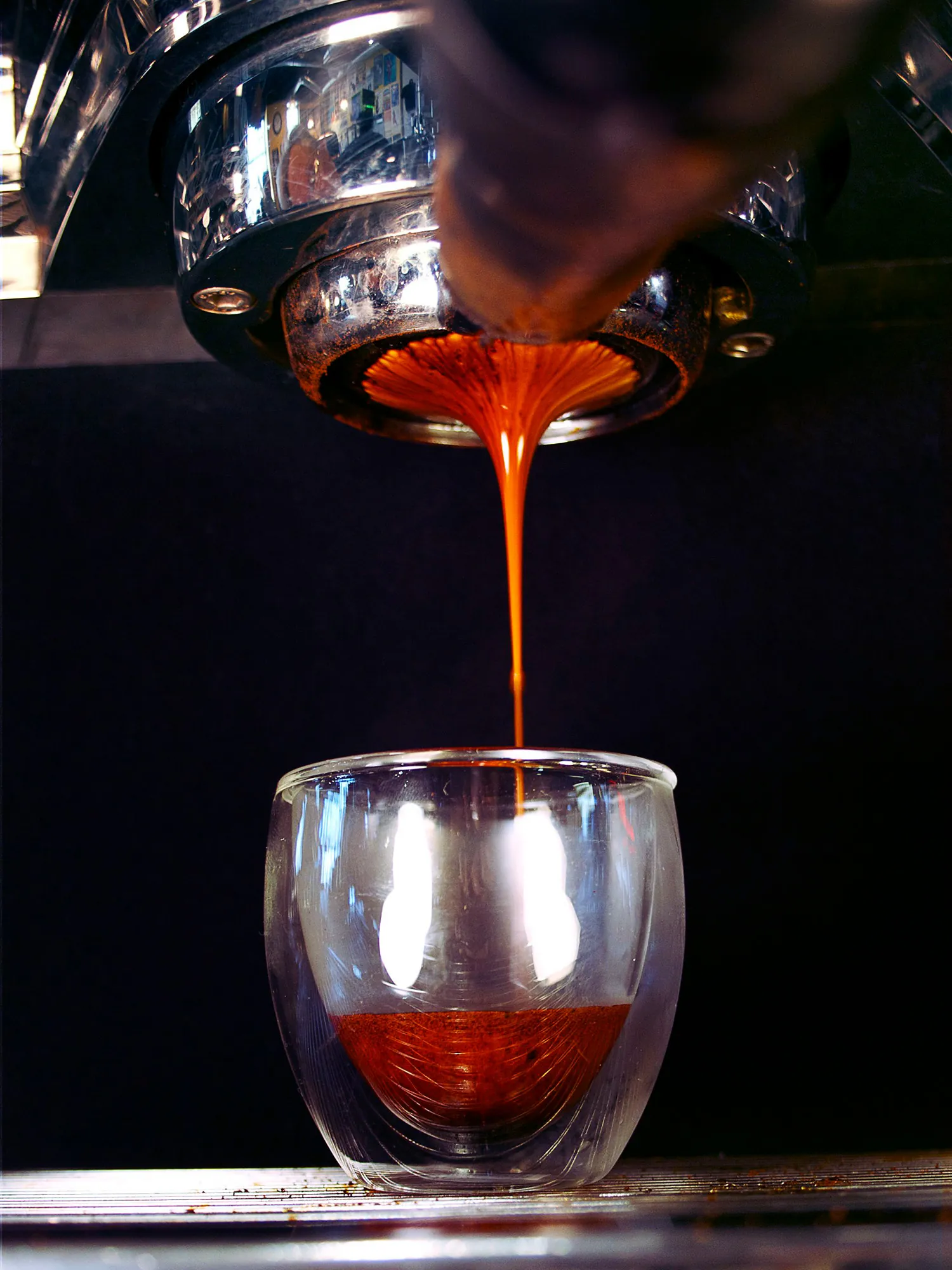 espresso shot pouring into glass