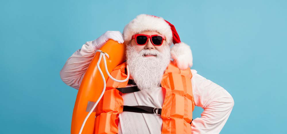 Santa in a life vest.