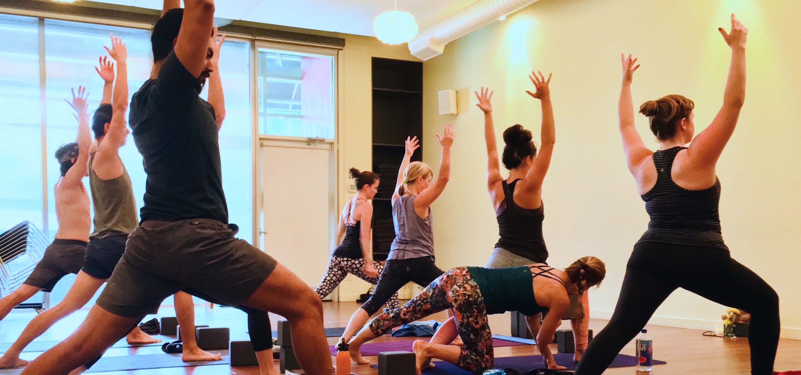 A group of adults in a yoga class.