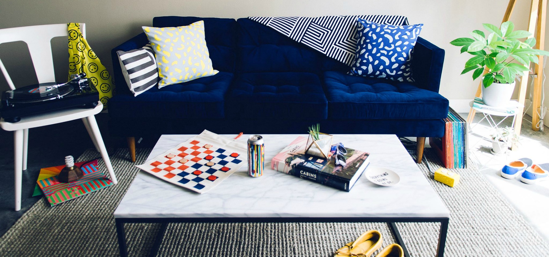 living room scene with blue couch