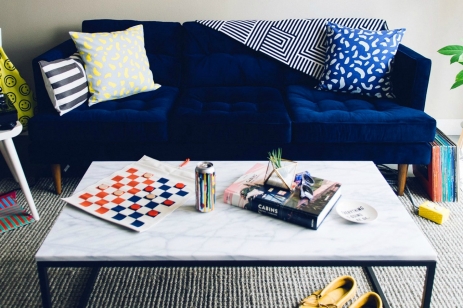 living room scene with blue couch