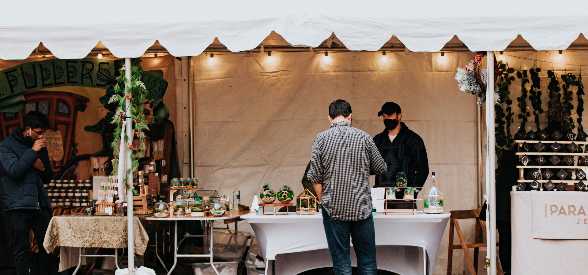 Man shopping at a holiday farmer's market.