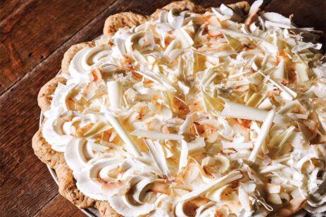 Coconut cream pie on a table top.