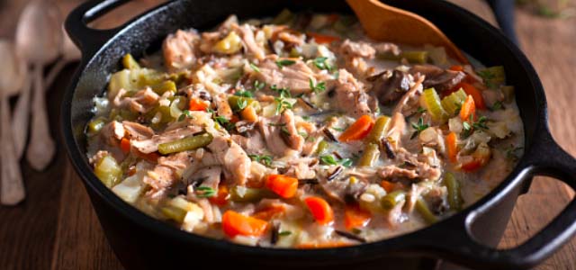 Pot of creamy chicken and rice soup.