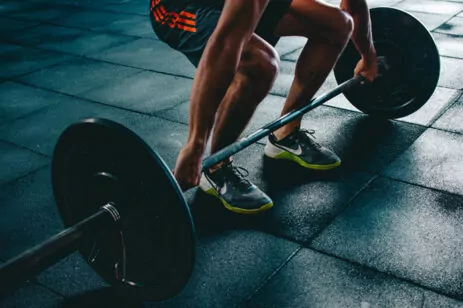 person lifting barbell