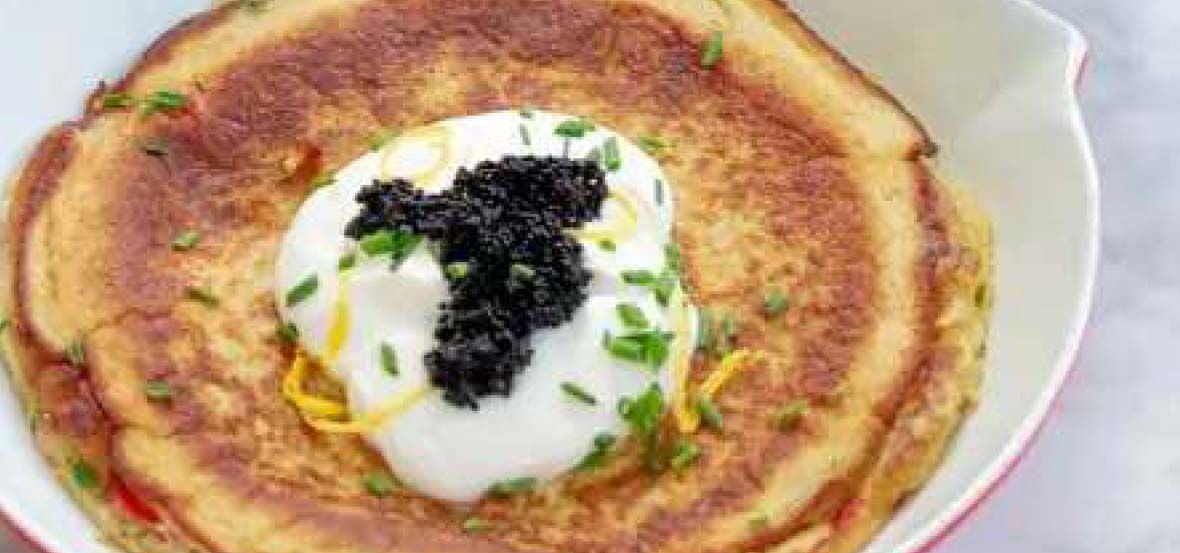 Salmon dutch baby pancake in a baking dish.