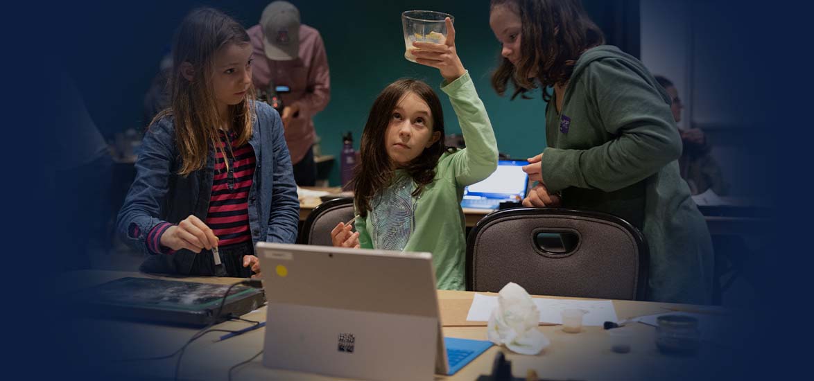 Girls working in a science lab.