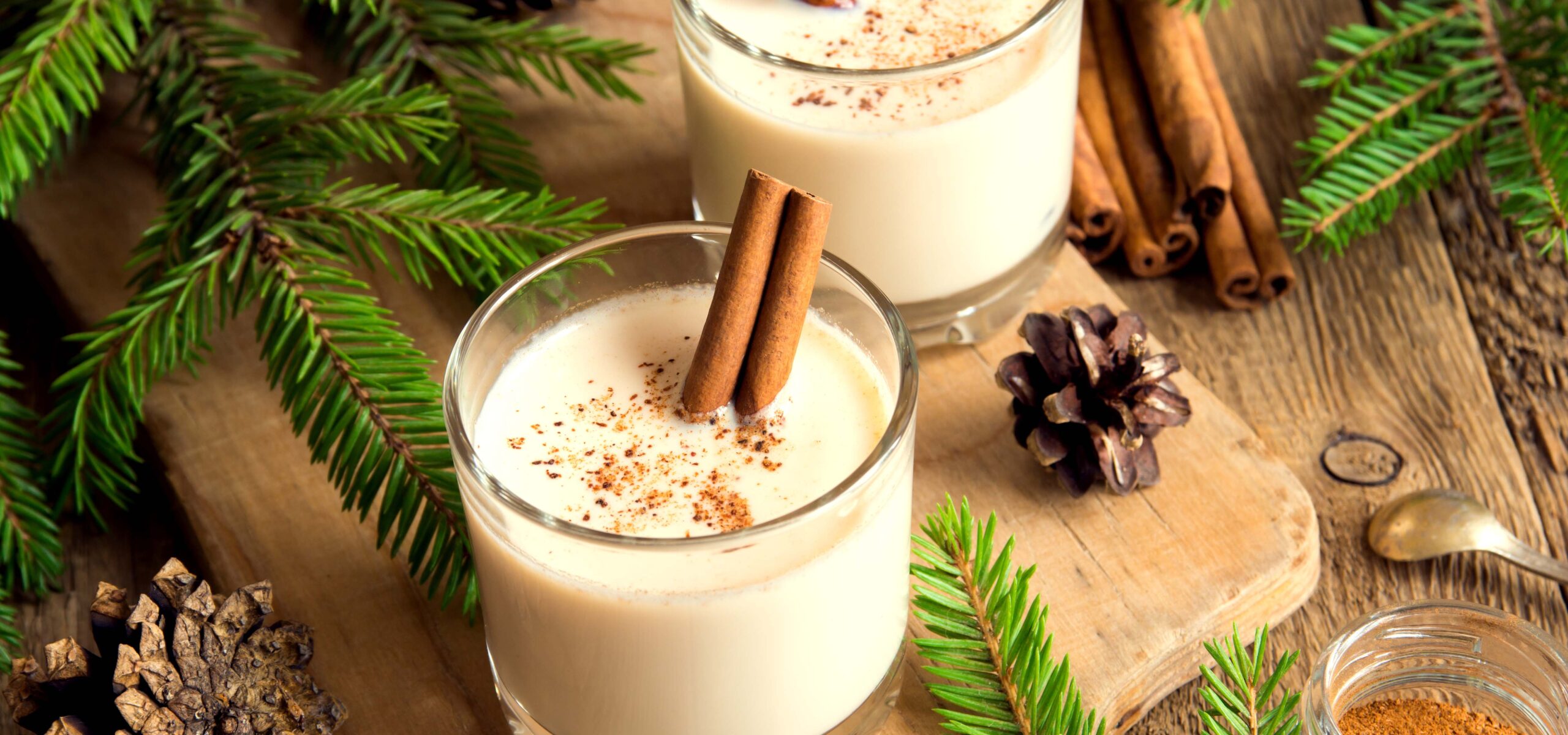 Cups of egg nog on a table.