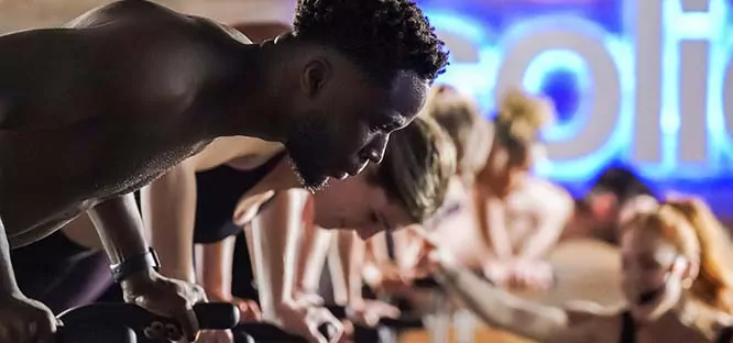 Row of people doing planks as a workout.