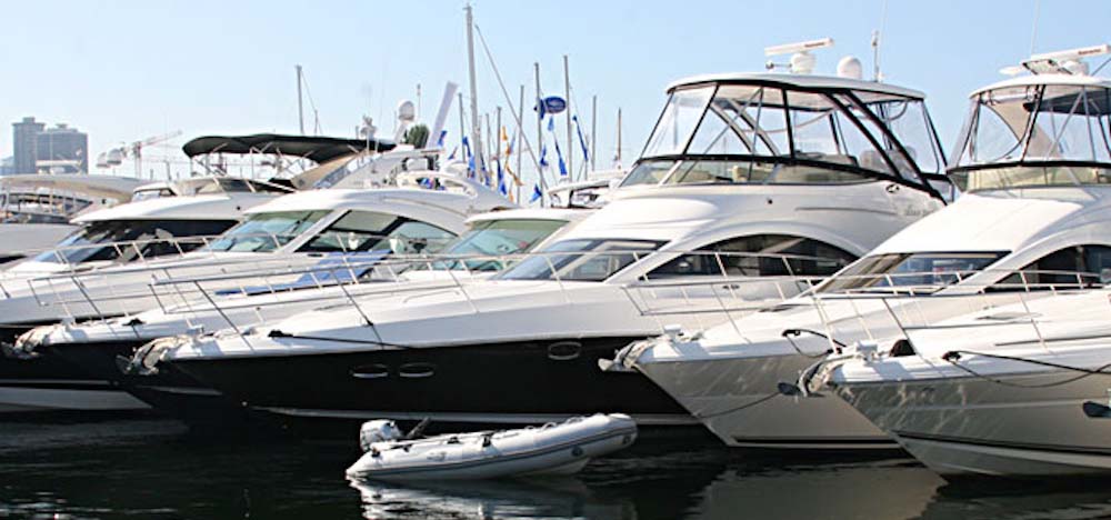 Yachts moored in slips at a marina.