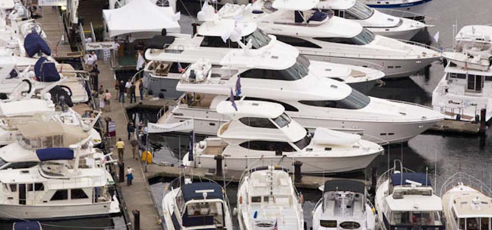 Yachts moored in slips at a marina.