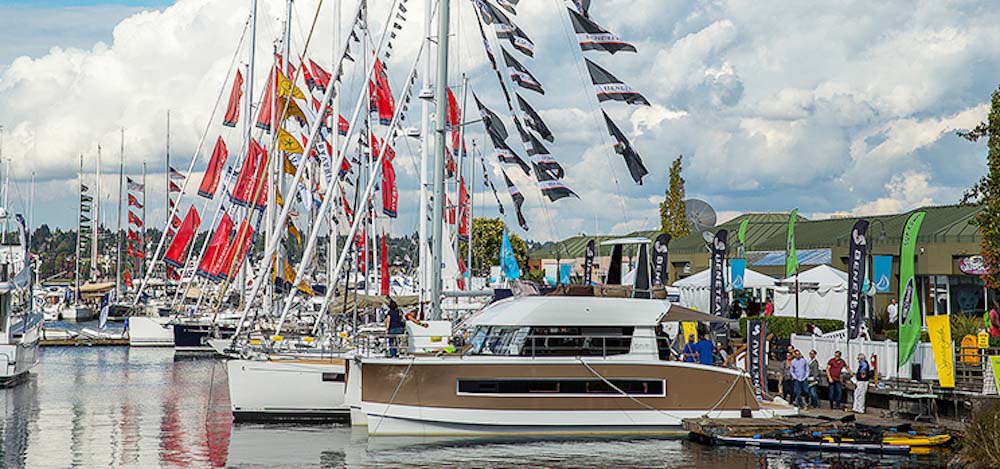 Yachts moored in slips at a marina.